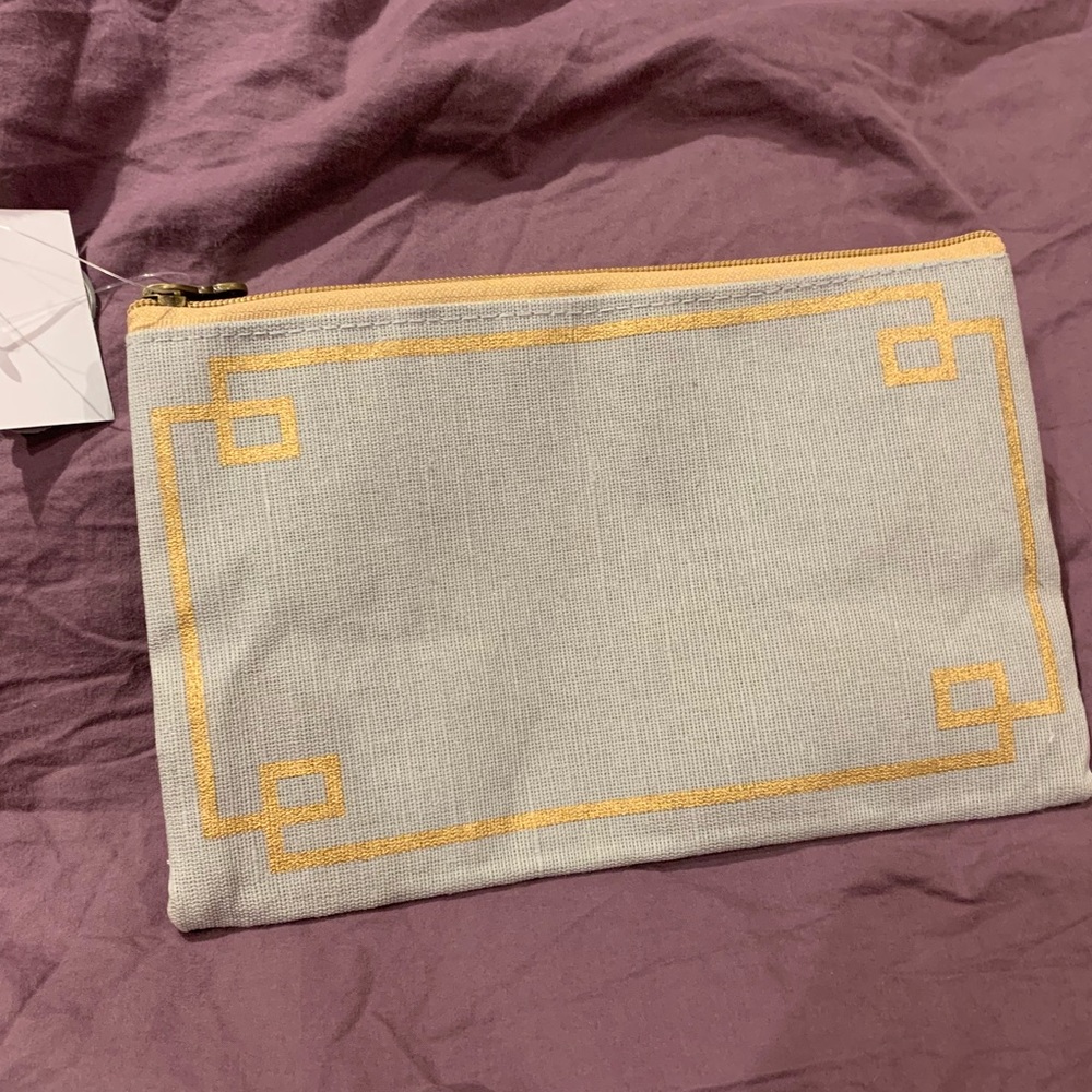 Gray and gold bag